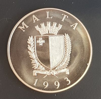 an image of a silver coin with a crown on top of it