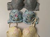 several bras are lined up on a white surface
