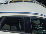 many cars parked in a parking lot next to each other