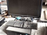 a computer sitting on top of a table with a keyboard and mouse