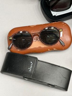a pair of sunglasses and a case sitting on a table