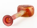 a glass pipe that is sitting on top of a table