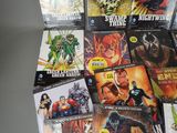 a lot of comic books that are on the table
