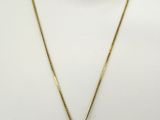une photo d'un collier en or sur un mannequin, un mannequin, un mannequin, un mannequin, un mannequin, un mannequin, un mannequin, un mannequin