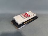 an image of a model of a white car on a black stand