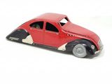 a toy car that is sitting on a white surface