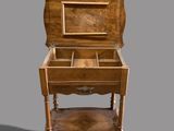 a small wooden table with a drawer on top of it