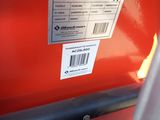 a close up of a label on a red vehicle