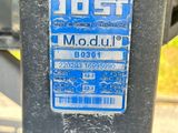 a close up of a parking meter with a sticker on it