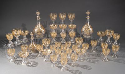 a lot of wine glasses that are sitting on a table