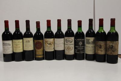 several bottles of wine are lined up in a row on a table