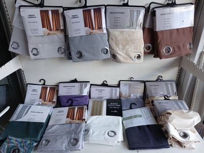 many different types of socks on display in a store