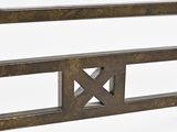 a close up of a metal bed frame with a wooden headboard