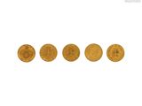 a group of five gold coins sitting on top of each other