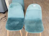 three chairs that are sitting on a wooden floor