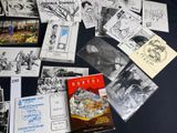 a lot of postcards that are on a table