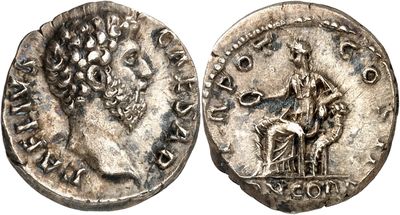 a silver coin with an image of a man on a horse