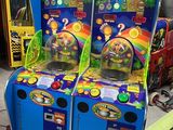 two arcade machines that are sitting in a room