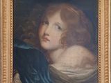 portrait d'une jeune fille en robe bleue, dans un cadre doré