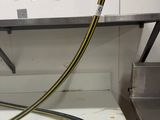 a blue hose that is connected to a white box