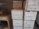 many boxes on a shelf in a room