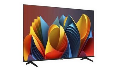a flat screen tv on a white background with colorful papers
