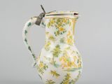 an image of a vase with a handle on a gray background
