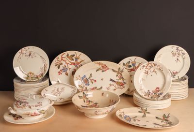 a lot of plates and bowls on the table
