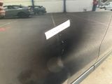 someone is taking a picture of the reflection of a car in the mirror