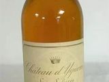 an image of a bottle of wine sitting on top of a table
