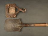 an old shovel and a leather case sitting on top of a table