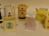 many different types of coffee mugs sitting on a table