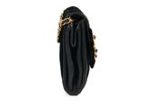 a black purse with a gold chain hanging from it