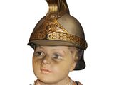 a statue of a boy wearing a helmet and a dress