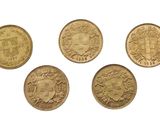 four different types of gold coins on a white background