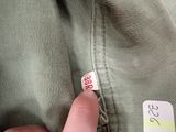 a person holding a sticker with a price tag on it