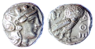a close up of a coin with a roman head on it