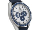 a close up of a watch on a white background with a blue strap