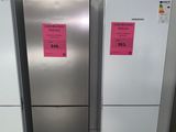 two refrigerators that are next to each other on the floor