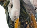 a white bird that is sitting on a tree branch