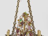 an image of a chandelier hanging from a ceiling with birds and flowers on it