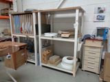 a room with a lot of shelves and boxes on it