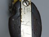 a close up of a metal object with a key on it