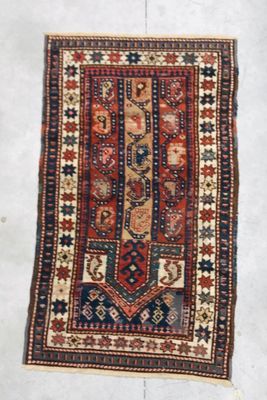 a close up of a rug on a floor with a white background