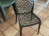 two chairs that are sitting on the floor in a restaurant