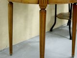 a table with a mirror and a chair in a room