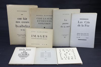 several books are stacked on top of each other on a table