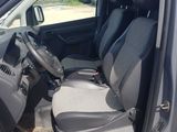 the interior of a car with the door open and the driver ' s seat up