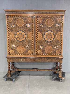 an image of a wooden cabinet with a floral design on it