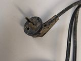 a metal object that looks like a bird on a wire